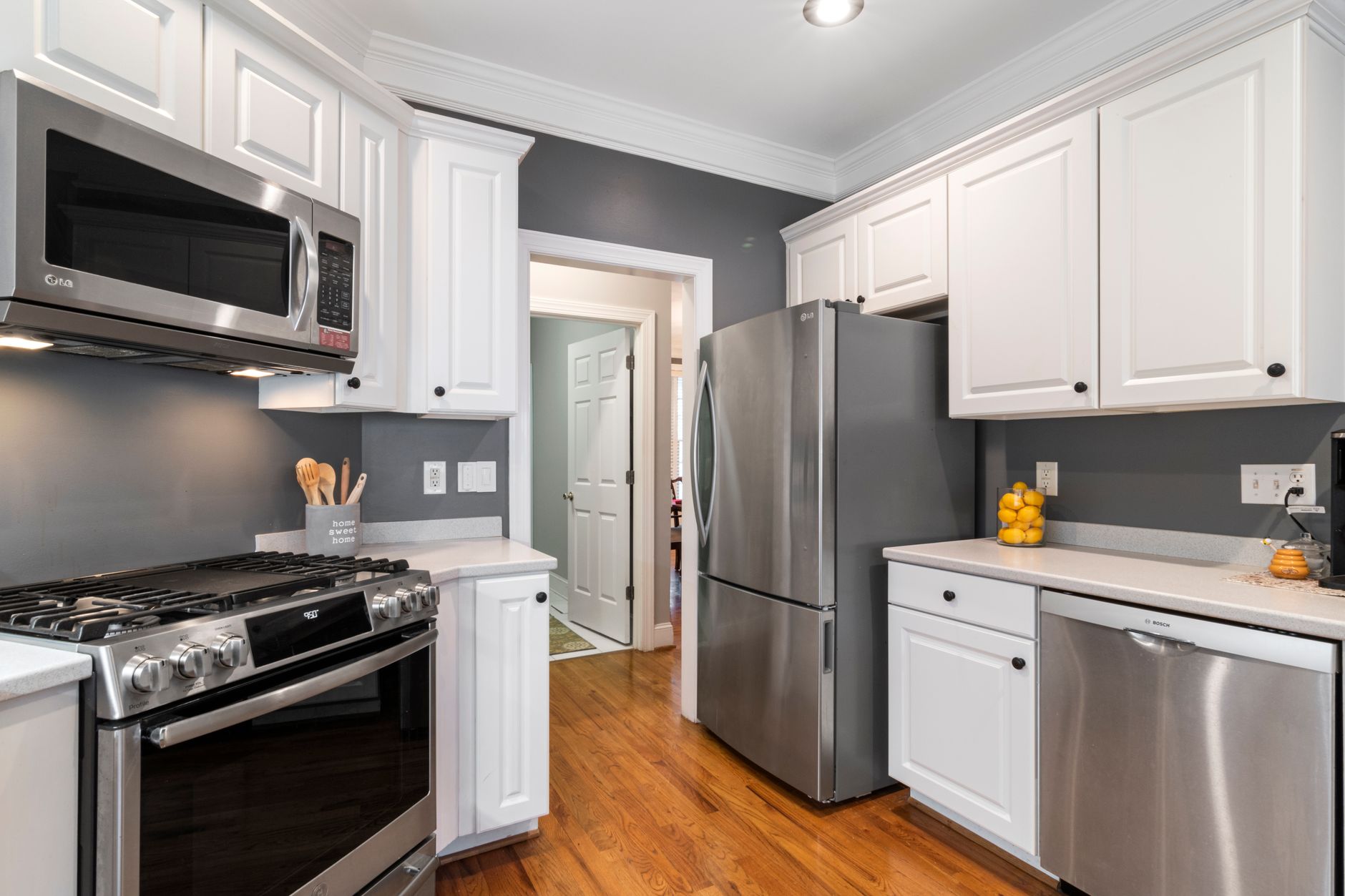 Contemporary kitchen with stainless steel appliances and white cabinets in Riverside, CA